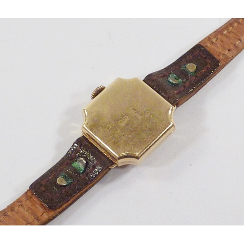 28 - A ladies' square wristwatch comprising a manual wind movement in a 9ct gold case.  18mm across head.