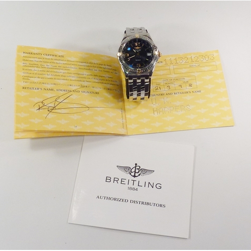 4 - A Breitling Wings bracelet watch having an automatic movement in a steel case with blue dial and uni... 