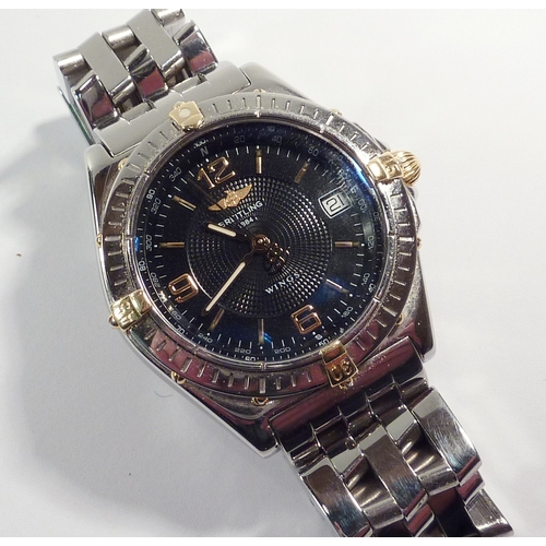 4 - A Breitling Wings bracelet watch having an automatic movement in a steel case with blue dial and uni... 