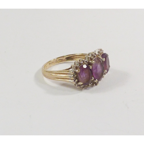 43 - A triple cluster ring comprising three pink amethysts surrounded by a line of diamonds in a 9ct gold... 