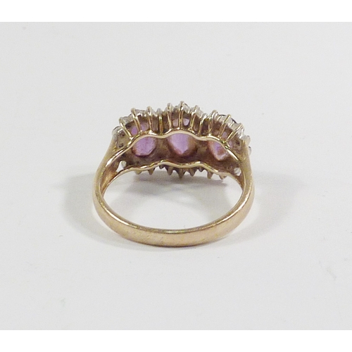 43 - A triple cluster ring comprising three pink amethysts surrounded by a line of diamonds in a 9ct gold... 