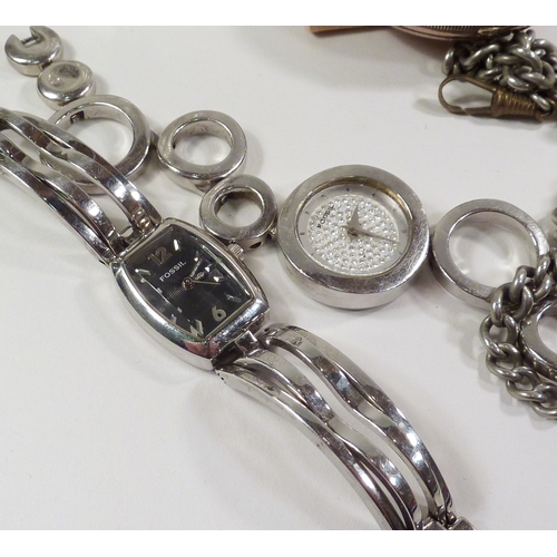 47 - A silver pocket watch having a key wind fusee movement in an open silver case, the whole suspended o... 