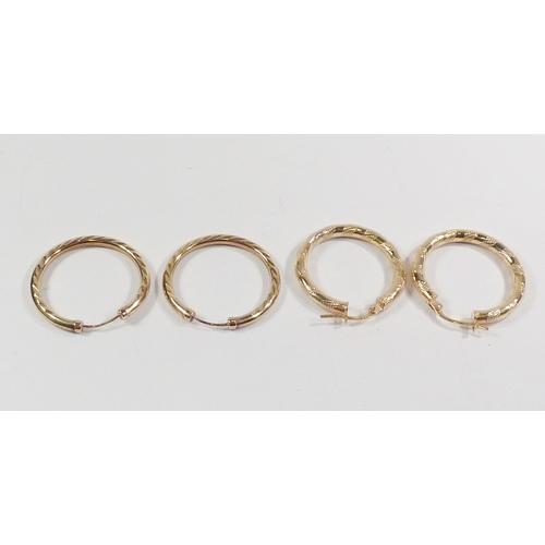 49 - Two pairs of hollow hoop earrings, yellow metal variously marked 9ct / 375.  Each approximately 25mm... 