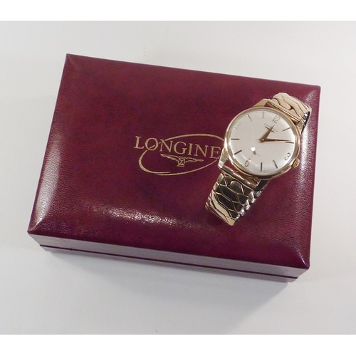 5 - A Longines wristwatch having a manual wind movement bearing signed crown under a cream dial in a 9ct... 