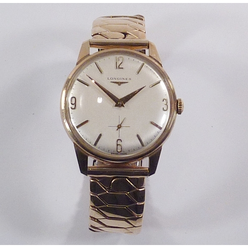 5 - A Longines wristwatch having a manual wind movement bearing signed crown under a cream dial in a 9ct... 