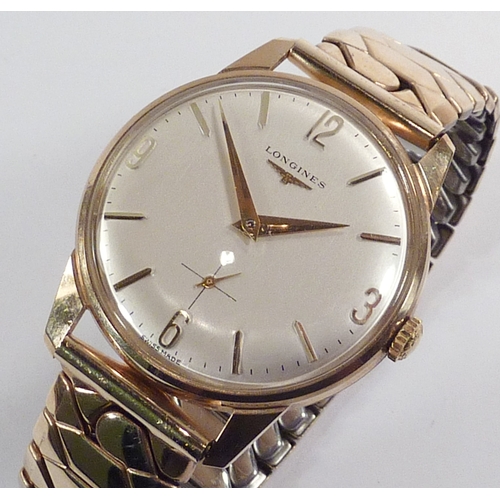 5 - A Longines wristwatch having a manual wind movement bearing signed crown under a cream dial in a 9ct... 