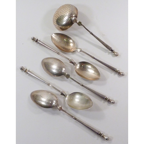 59 - A group of ten German white metal coffee spoons with a matching sugar sifter, marked DK 800. A/F dam... 