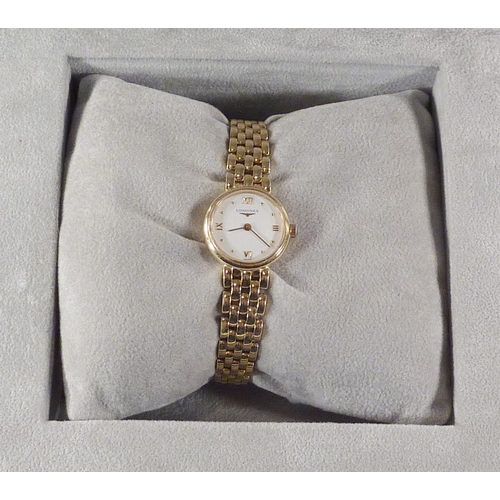 6 - A Longines ladies' bracelet watch having a  quartz movement under a white dial in an 18ct gold case ... 