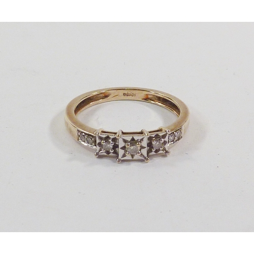 63 - An illusion set ring of stepped design comprising seven diamonds in a 9ct gold setting.  Gross weigh... 