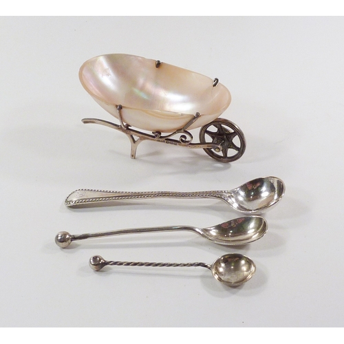 69 - A novelty table salt as a wheelbarrow comprising a seashell in a silver mount, 75mm long, a/f; a sil... 