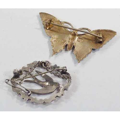 75 - A butterfly brooch, white metal and enamel, Henry James Hulbert c1915.  51mm across wings; other bro... 