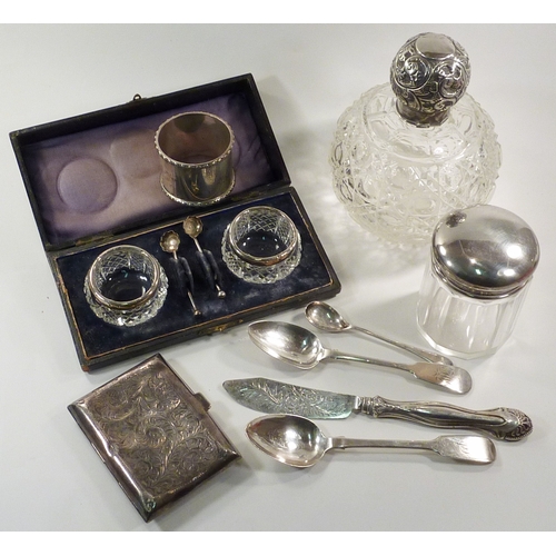 78 - Silver incl a cigarette case; a napkin ring; case silver rimmed salts; three various spoons etc.  14... 