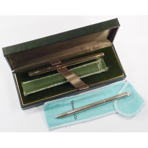 82 - A Tiffany & Co ball-point pen, silver marked Sterling 925, with soft bag; a Cross gold plated founta... 