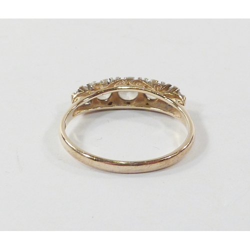 102 - A five stone ring comprising cubic zurconia in a 9ct gold setting.  Gross weight 1.9g