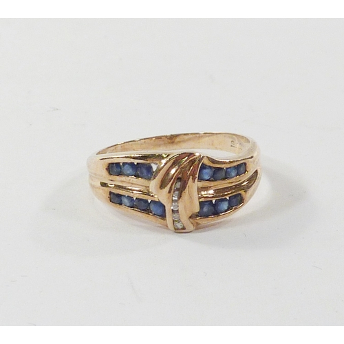 103 - A ring of waved form comprising diamonds and sapphires in a yellow metal setting marked 375.