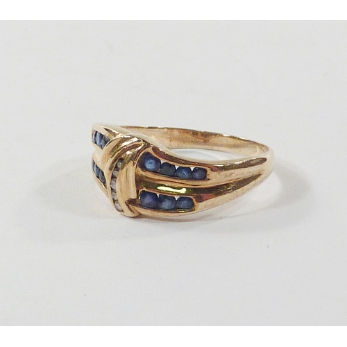 103 - A ring of waved form comprising diamonds and sapphires in a yellow metal setting marked 375.