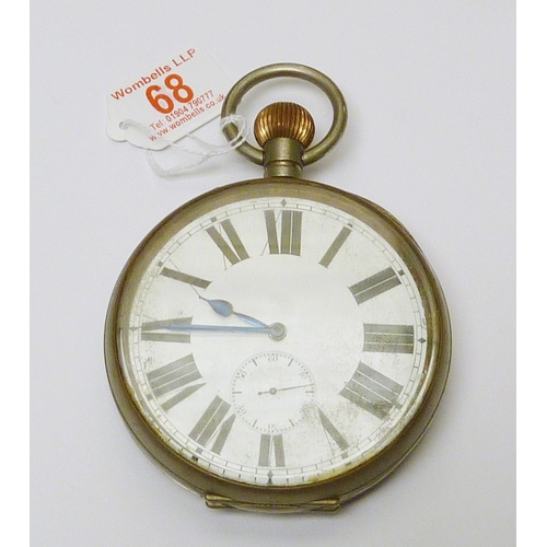 68 - An oversized pocket watch having a pin set lever movement in a base metal case.  102mm across case.