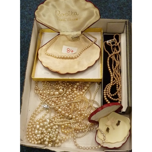 84 - A cased set of Rosita faux pearl necklace together with other similar necklaces; a group of powder c... 