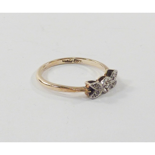 97 - A bow head illusion ring, comprising five diamonds in a yellow and white metal setting marked 18ct /... 