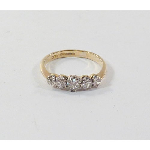 98 - A five stone diamond ring in an 18ct gold setting.  Central stone 2.5mm diameter / gross weight 2.2g