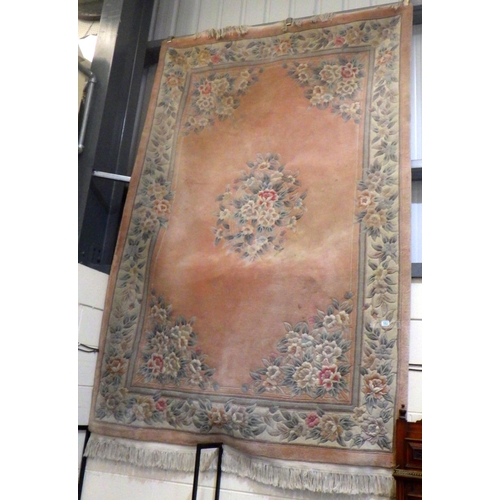 889 - A pink ground Chinese rug, 290 x 183cm, marks