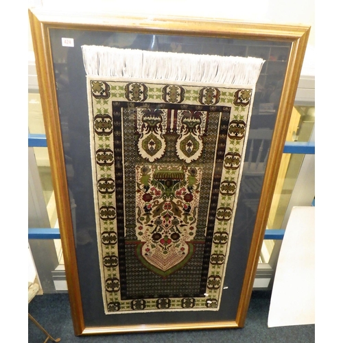 237 - A framed prayer rug (130 x 63cm rug )