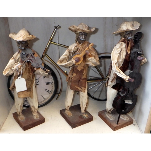 14 - Three paper mache musical Mexican figures together with a novelty bicycle clock (4)