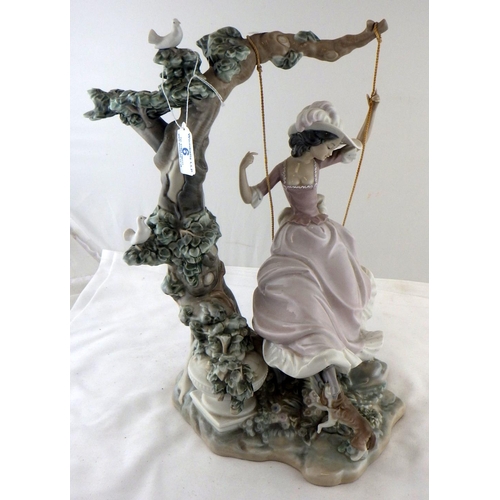 6 - A Lladro figurine depicting a girl on a swing.  A/F, foot broken