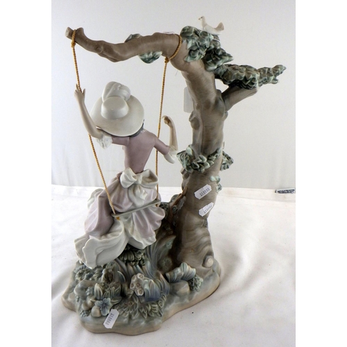 6 - A Lladro figurine depicting a girl on a swing.  A/F, foot broken