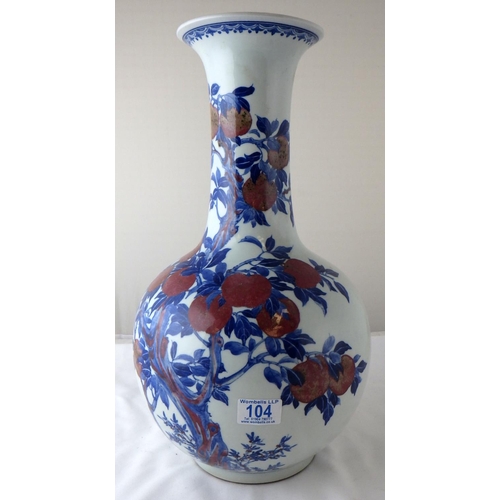 104 - A bulb-shaped vase having an apple tree motif decoration.  44cm tall