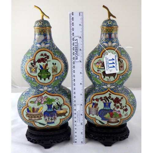 111 - A pair of Chinese cloisonné  double gourd shaped flasks with carved stands.  Each 33cm tall on stand... 