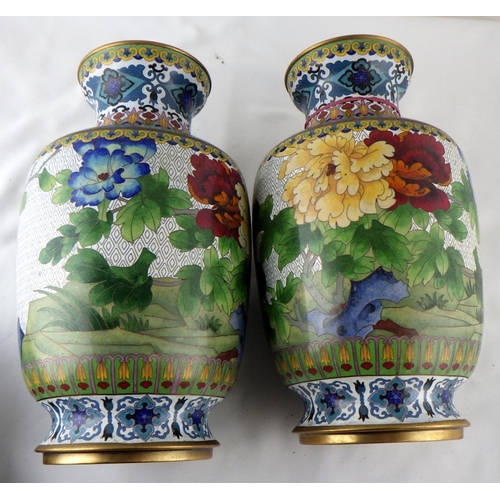 113 - A pair of Chinese cloisonné enamel vases having carved bases. Each 35cm total height