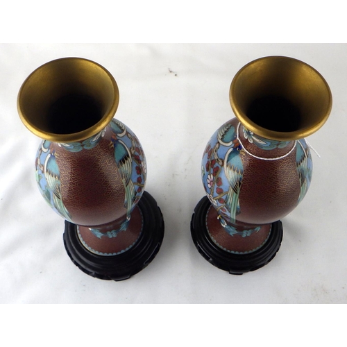 116 - Two pairs of Chinese cloisonné enamel vases, the pair on carved stands 24cm tall.  (4)