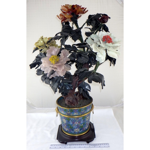 123 - A Chinese hardstone Peony tree presented in a cloisonné enamel flowerpot on a hardwood stand.  72cm ... 