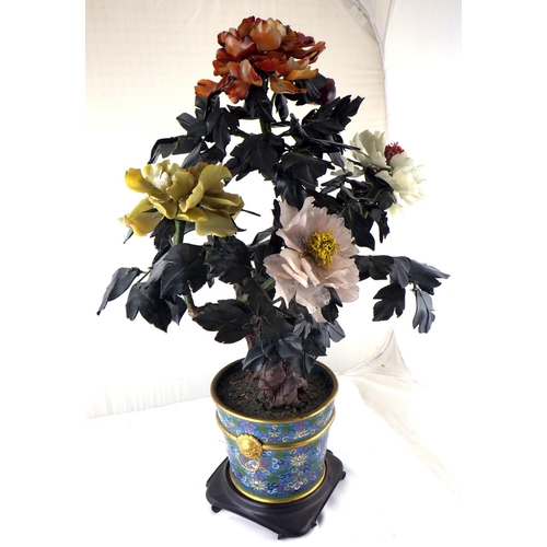 123 - A Chinese hardstone Peony tree presented in a cloisonné enamel flowerpot on a hardwood stand.  72cm ... 