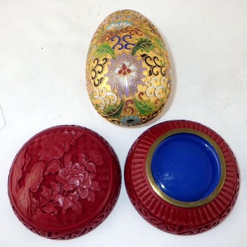 129 - A Chinese cloisonné enamel egg, 12cm tall; a Chinese black and red Cinnabar dish with similar ashtra... 