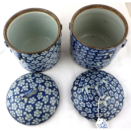 130 - Two Chinese circular porcelain covered boxes of matching design and having similar blue and white fl... 