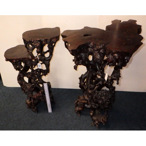 143 - Two Oriental carved root plant stands / occasional tables, the larger 71.5cm tall.  (2)
