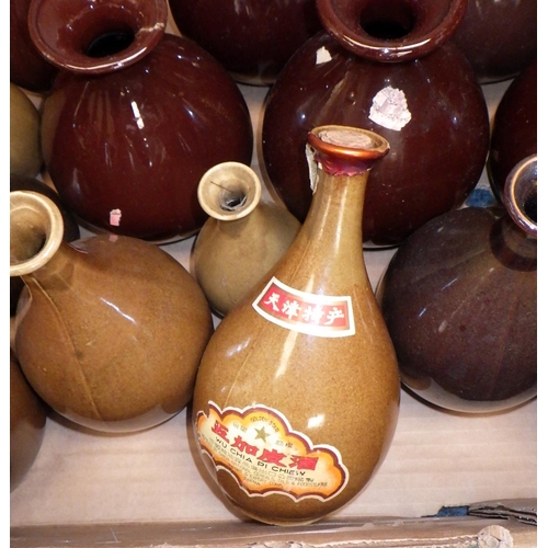 151 - A collection of rice wine bottles.  (2)