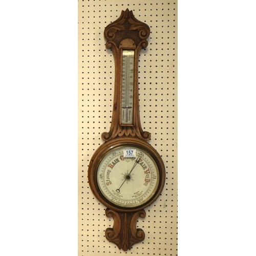 157 - An oak cased wall barometer, 81cm tall.