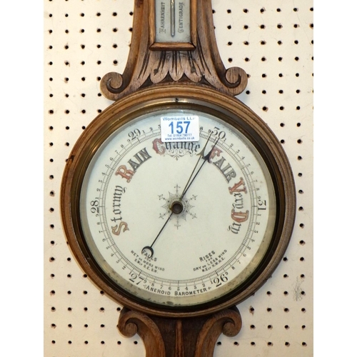 157 - An oak cased wall barometer, 81cm tall.