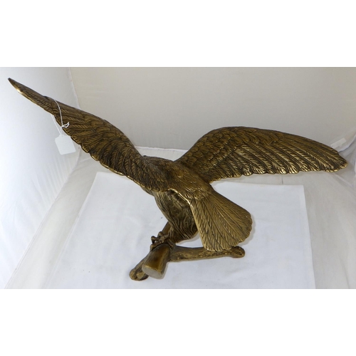 159 - A brass eagle.  55cm tall