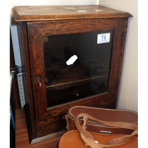 74 - An oak smokers' cabinet, book rest and two pairs of binoculars