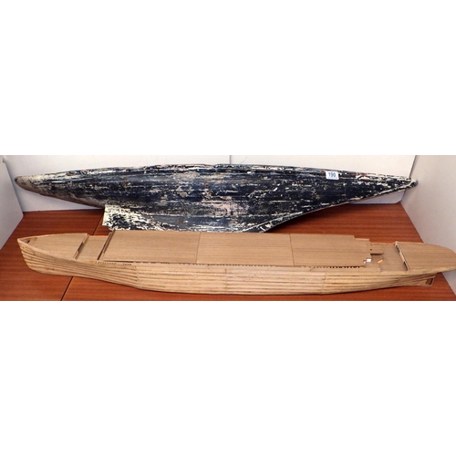 190 - A pond yacht hull, 121cm long; a wooden model of a liner hull. (2)