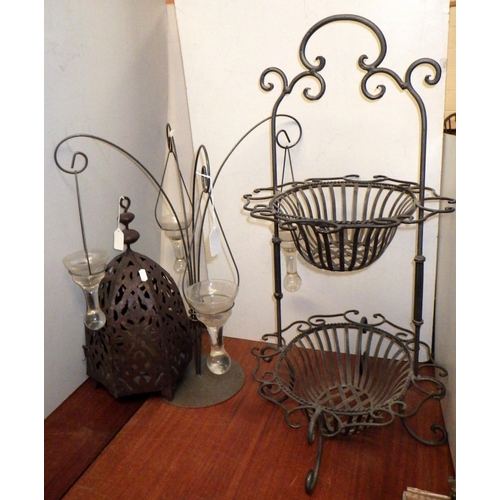 200 - A metal lantern in middle eastern manner; a four branch candle holder; a two tier stand. (3)