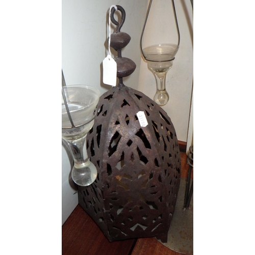 200 - A metal lantern in middle eastern manner; a four branch candle holder; a two tier stand. (3)