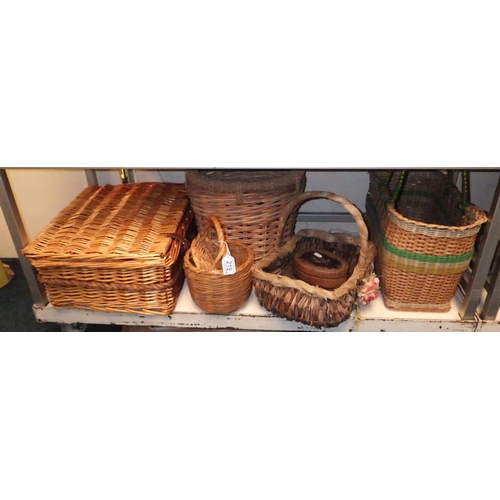 219 - A wicker picnic hamper; a qty of baskets; a woolwork firescreen.