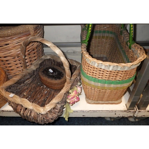 219 - A wicker picnic hamper; a qty of baskets; a woolwork firescreen.