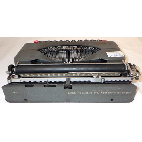 256 - An Empire Autocrat typewriter together with a tray lot of misc collectables (2)