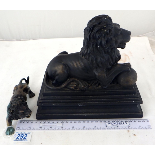 292 - A small cast lion together with a resin recumbent lion (2)